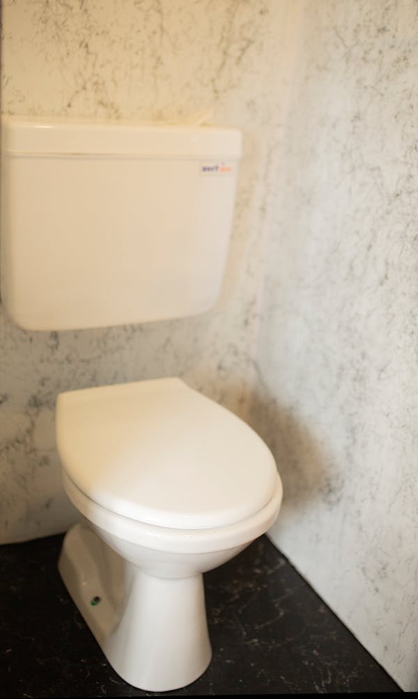 Clean white toilet bowl in a modern Singapore bathroom