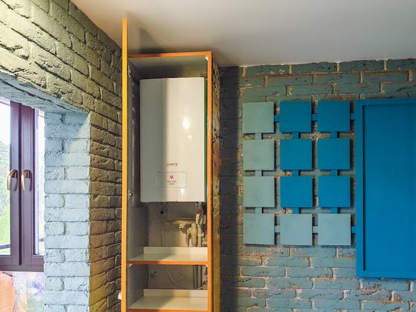Water heater installed neatly inside a cabinet